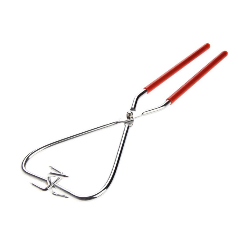 Metal tongs with red handles and three-pronged end, isolated on white