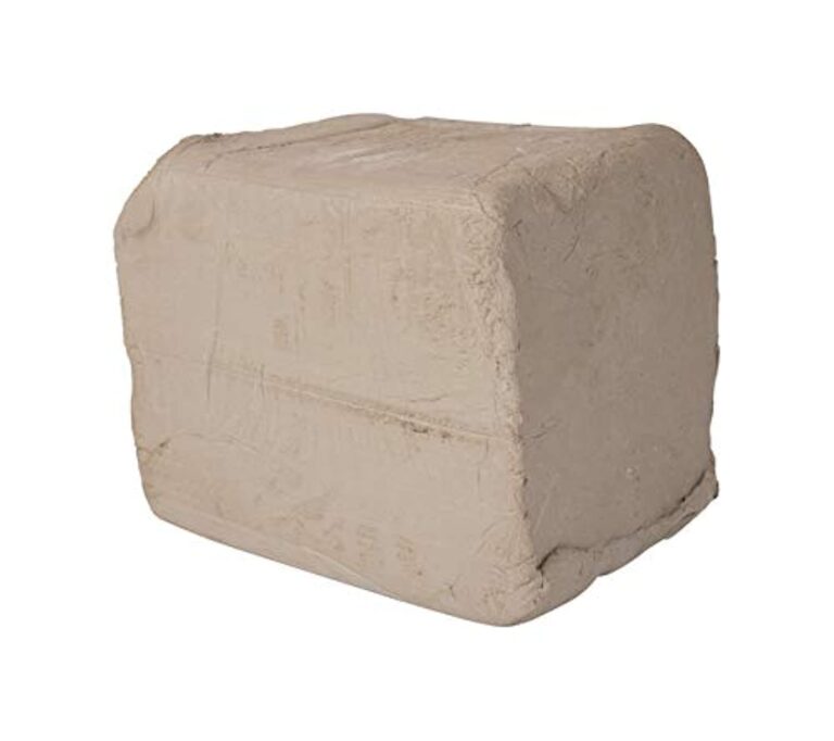 A rectangular block of beige clay, ready for pottery