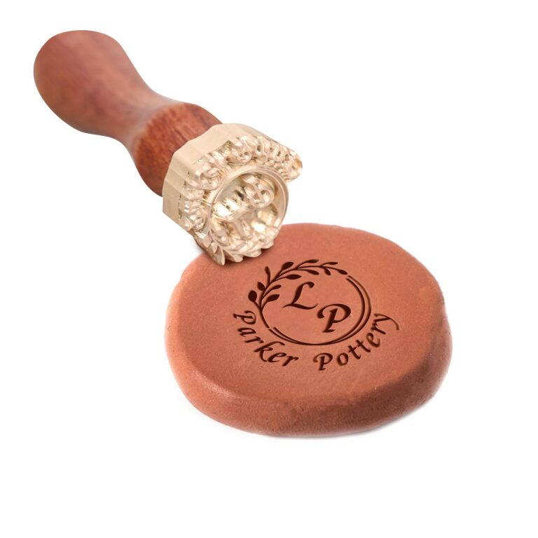 Wax seal stamp with "Parker Pottery" logo on a clay disc