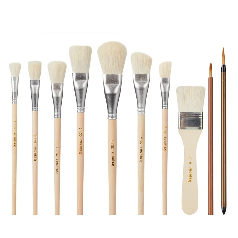 Collection of various paint brushes with wooden handles, arranged on white background