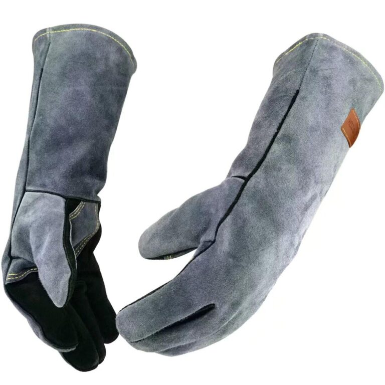Two gray leather welding gloves with long cuffs, isolated on white