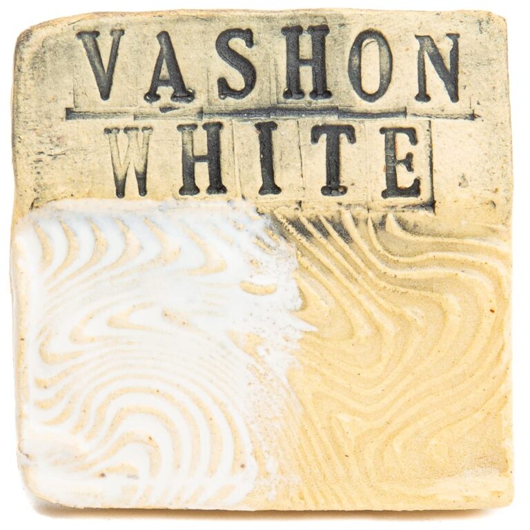 Ceramic tile with "Vashon White" text and swirled white and tan glaze