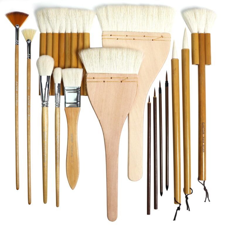 Collection of various artist brushes with wooden handles and white bristles