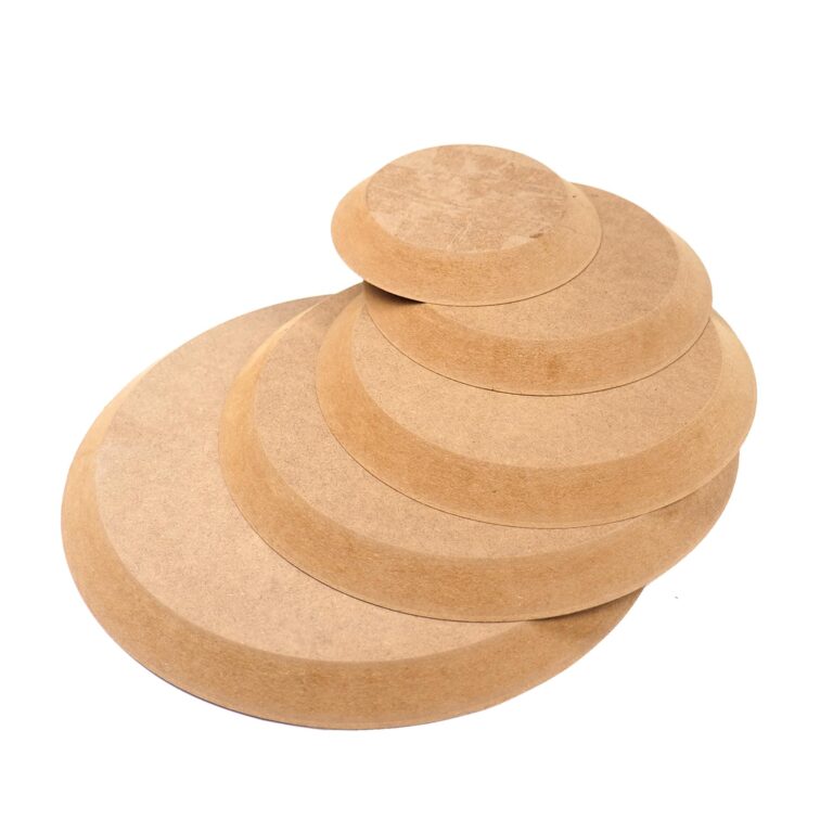 Stack of wooden circles of varying sizes, isolated on white